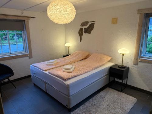 a bedroom with a bed with two lamps on it at Haven Fortress in Kalven