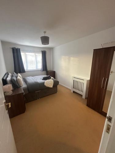 a bedroom with a bed and a window at A Home From Home in Crawley