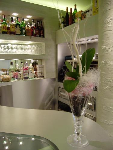 a vase with plants in it sitting on a table at Hotel Sirio in Lido di Camaiore