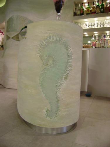 a toilet paper holder with a se on it at Hotel Sirio in Lido di Camaiore