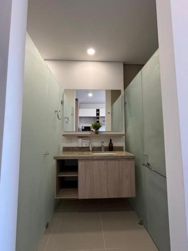a bathroom with a sink and a mirror at Reserva del Mar II 821 in Gaira