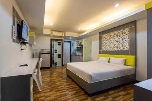 En eller flere senge i et værelse på The Ring Residence