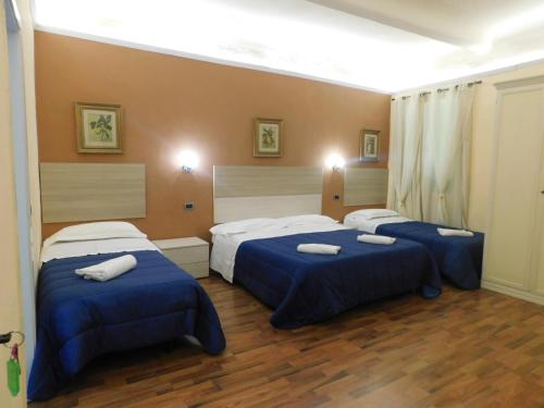 En eller flere senge i et værelse på PICCOLO HOTEL Nel Centro Storico di Firenze