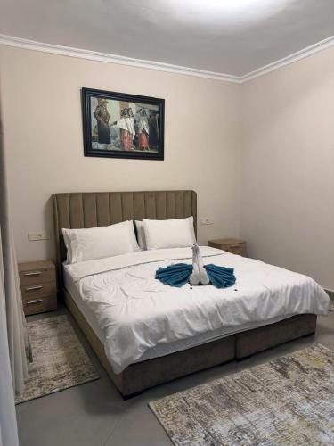 a bedroom with a bed with a stuffed animal on it at Relaxing Apartment Near the Beach Malabata Tanger in Tangier