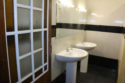 a bathroom with a sink and a mirror at Villa 92 City Stay in Kandy