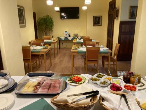 a table with food on it in a dining room at Zeilinger Villa in Knittelfeld