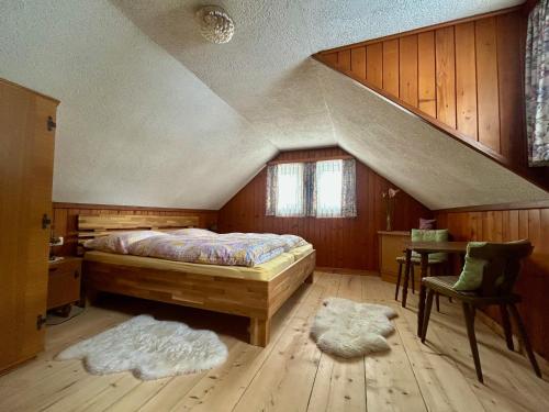 a bedroom with a bed in a attic at Ferienhaus Feichtn Schuster in Gosau