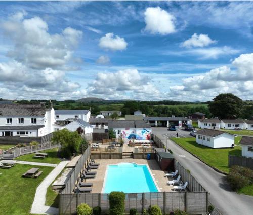 an aerial view of a resort with a swimming pool at Gateway to Cornwall in St Austell