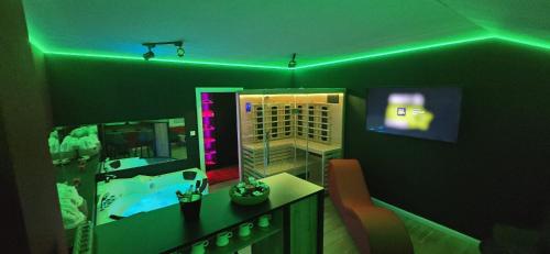 a room with a bathroom with a tub and a mirror at Apartman Fantazy spa BDSM in Zemun