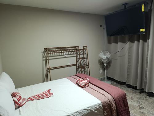 En eller flere senge i et værelse på Suite 103 Cordoba Centro con Estacionamiento