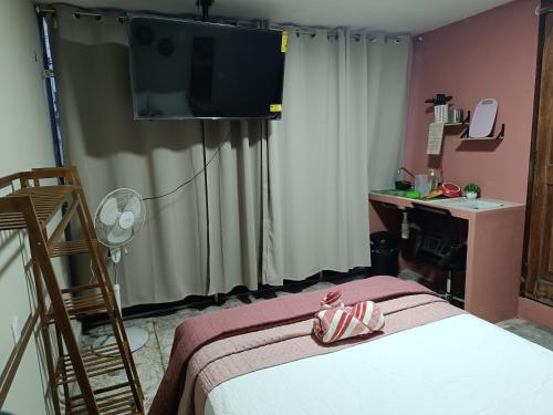 En eller flere senge i et værelse på Suite 103 Cordoba Centro con Estacionamiento