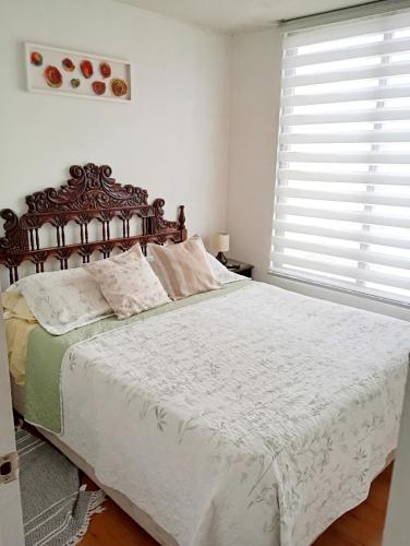 En eller flere senge i et værelse på Departamento a pasos playa la herradura