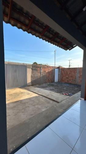 a view of a patio from the inside of a house at Casa de praia Cleo in Luis Correia
