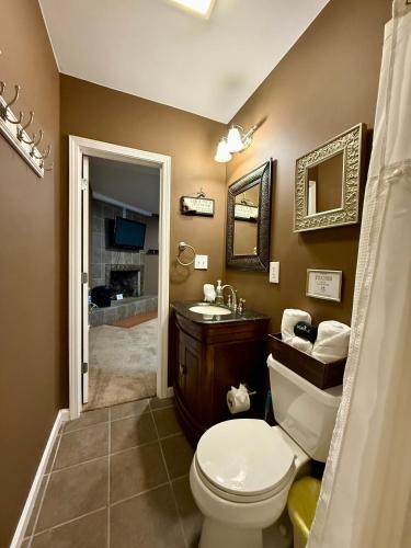 a bathroom with a toilet and a sink at Lake Front Sunset | New Deck | Kayaks | Canoe in Salisbury