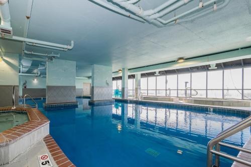 a large indoor swimming pool with blue water at Phoenix X 304 in Orange Beach