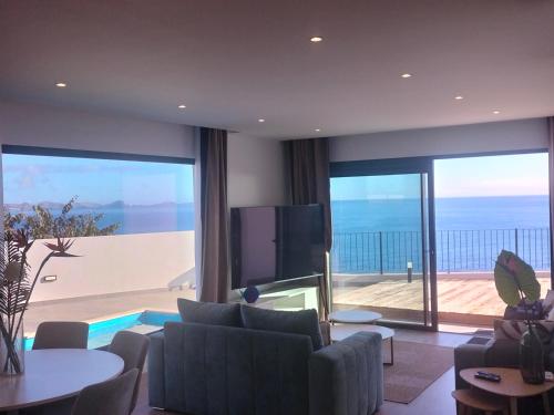 a living room with a view of the ocean at Villa Atlantic Lodjadis in Gaula