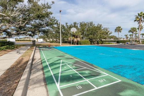a basketball court is painted blue and green at Phoenix East 1211 in Orange Beach