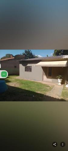 a picture of a house with a frisbee at QUARTO lado praça colchão sob estrado in Chapada dos Guimarães