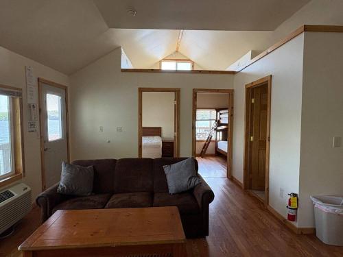 een woonkamer met een bank en een tafel bij Cliffside Hideaway-Renovations & upgrades coming! in Hammond