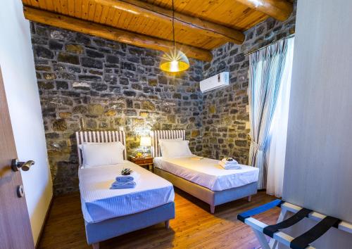 Postel nebo postele na pokoji v ubytování Vilana, nature-inspired retreat!