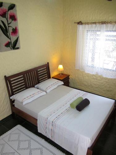 Ένα ή περισσότερα κρεβάτια σε δωμάτιο στο Pousada Oásis Ilha Grande