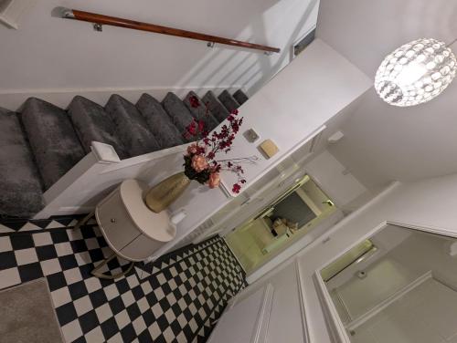 a bathroom with a toilet in the middle of a room at Cozy home in Birmingham