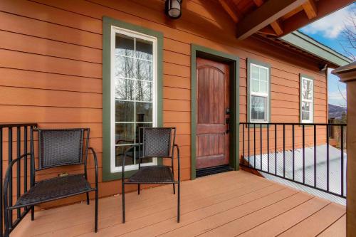 a house with two chairs on a porch with a door at Lookout Point - Retreat for 6 in South Lake Tahoe