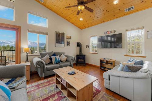a living room with a couch and a table at Lookout Point - Retreat for 6 in South Lake Tahoe