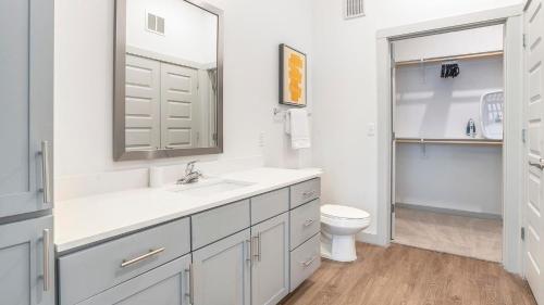 a white bathroom with a sink and a toilet at Landing Beautiful 2BD Pool Yoga Studio in Austin