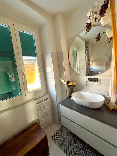 a bathroom with a sink and a mirror at Casa di Olli in Sestri Levante