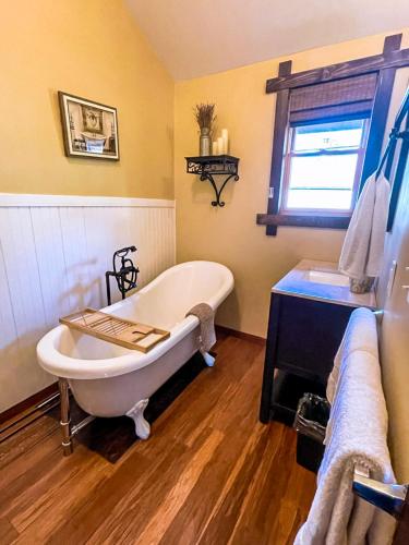 a bathroom with a bath tub and a window at 4 bedroom chalet in Hunter in Hunter