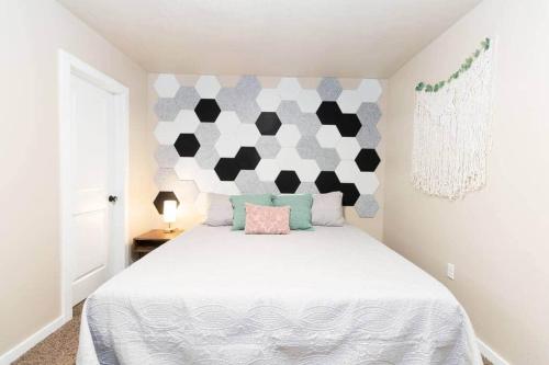 a bedroom with a bed with a black and white headboard at Cozy 1Bdrm•Self Check-in•Downtown in Salt Lake City