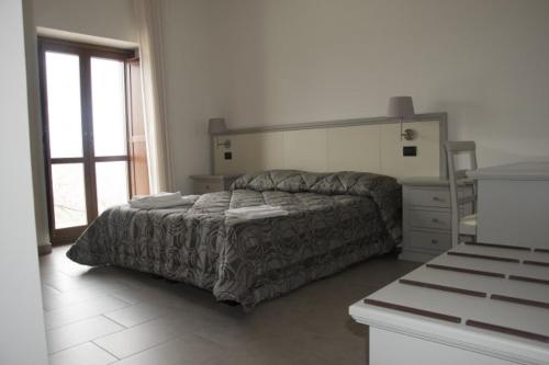 Ένα ή περισσότερα κρεβάτια σε δωμάτιο στο Agriturismo Terra Verde