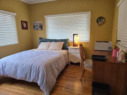 En eller flere senge i et værelse på The Ginkgo House