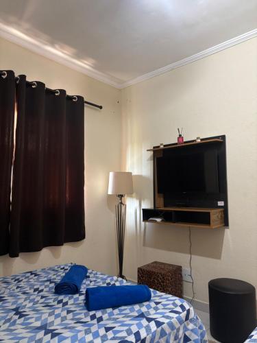 En eller flere senge i et værelse på Casa Central