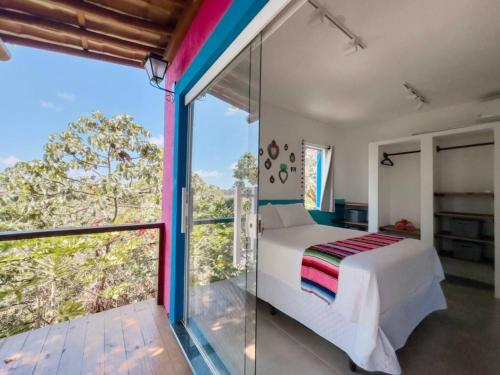 Giường trong phòng chung tại Vila Real Apartamentos