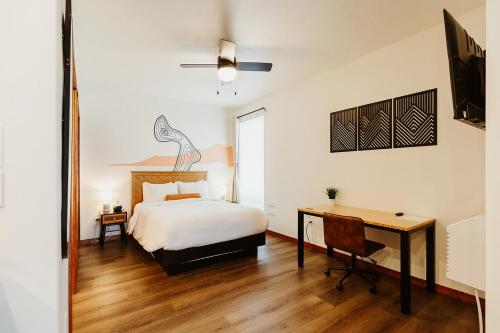 a bedroom with a bed and a desk at Big Mountain Suite Near Logan Health in Kalispell