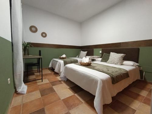 En eller flere senge i et værelse på Casa de Luis a 10 min Puy du Fou