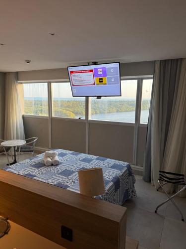 Giường trong phòng chung tại Paiva Home Stay com cama King e cozinha