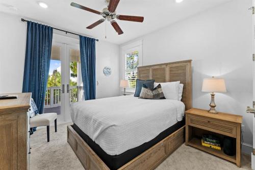 a bedroom with a bed and a ceiling fan at It's a Shore Thing in Inlet Beach