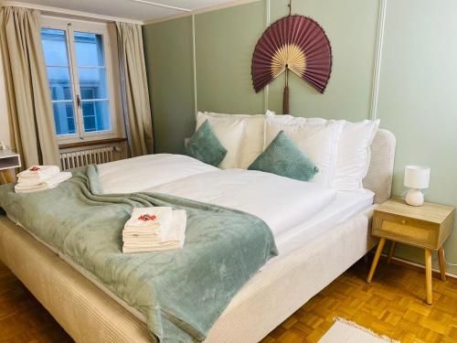 En eller flere senge i et værelse på Cara Nima Schwyz