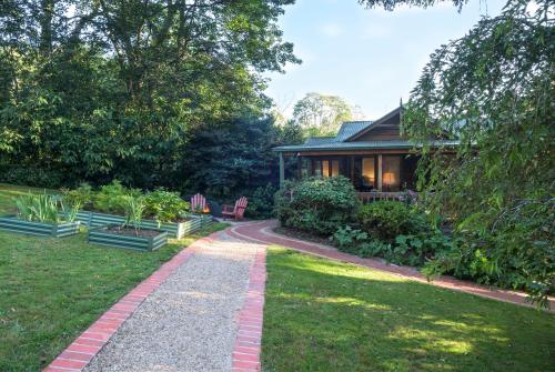 a path leading to a house in a garden at Botanica Retreat Garden Cabin in Olinda in Olinda