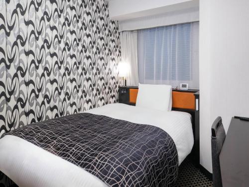Postel nebo postele na pokoji v ubytování APA Hotel Nihombashi Bakurocho Ekimae