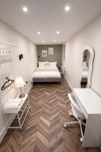 En eller flere senge i et værelse på Stylish Studios 20 min train to Central London