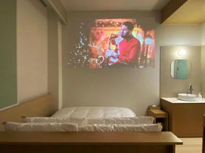 a room with a bed and a painting on the wall at Hotel MERV in Seryu-dong