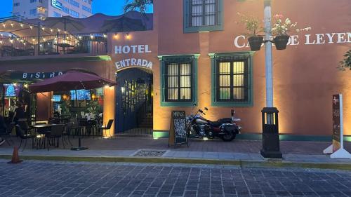 a motorcycle parked in front of a hotel at Casa de Leyendas in Mazatlán
