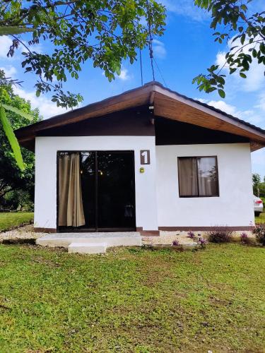 a small house with a large window at Hills Villa Rio Celeste in Rio Celeste