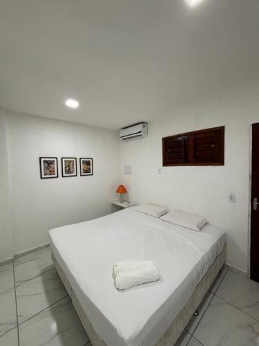 En eller flere senge i et værelse på Suites Premium Jacarey, Fortaleza