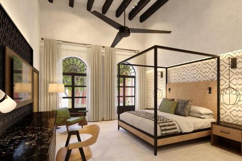 a bedroom with a canopy bed and a desk at Pueblo Bonito Vantage Centro Histórico Mazatlán in Mazatlán