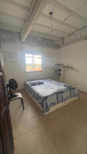 Giường trong phòng chung tại Casa com dois quartos no bairro Aliança com Deus